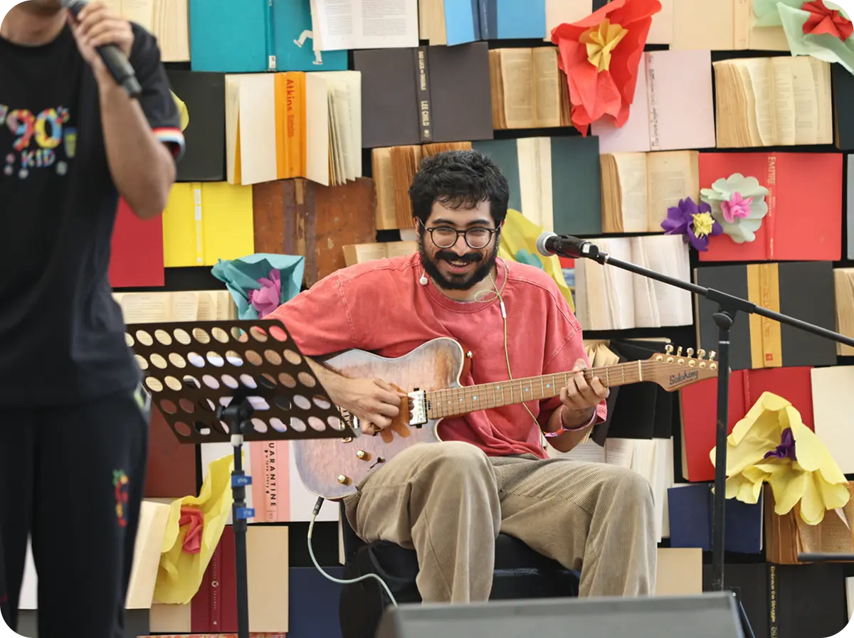 Performer with guitar on stage